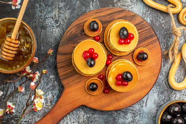 Top view on delicious pancakes with various ingredients