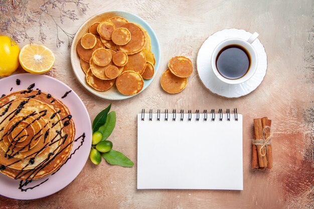 Top view on delicious pancakes with various ingredients