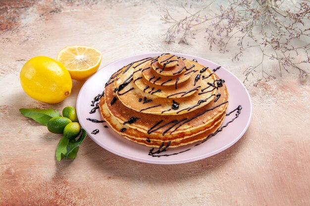 Top view on delicious pancakes with various ingredients