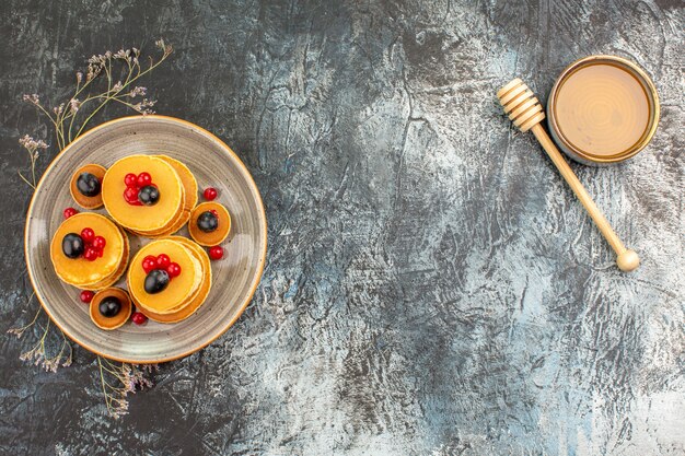 Top view on delicious pancakes with various ingredients