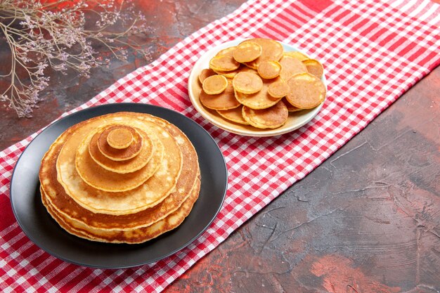 Top view on delicious pancakes with various ingredients