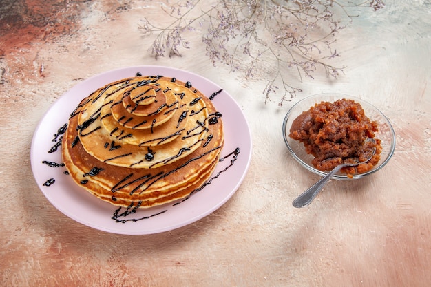 Top view on delicious pancakes with various ingredients