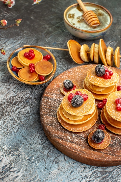 Top view on delicious pancakes with various ingredients