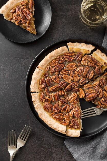 Top view delicious pecan pie with crust on the table