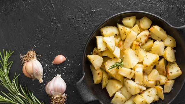 Top view delicious potatoes with garlic