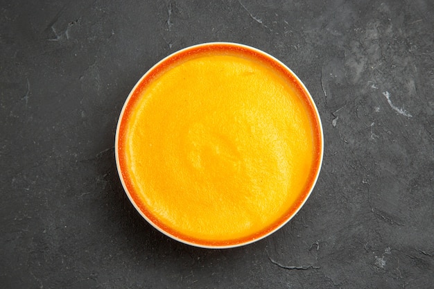 Free photo top view of delicious pumpkin soup in a bowl