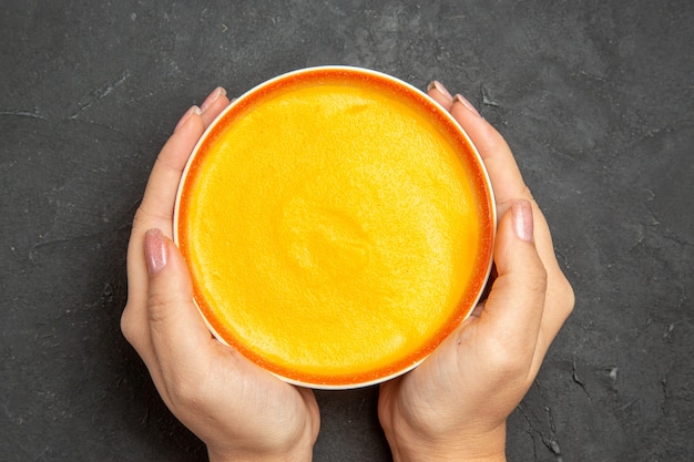 Top view of delicious pumpkin soup in a bowl