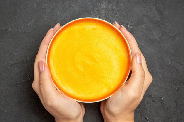 Top view of delicious pumpkin soup in a bowl