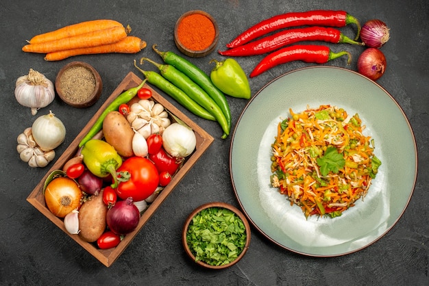 Top view delicious salad with fresh vegetables on a grey table food diet salad health