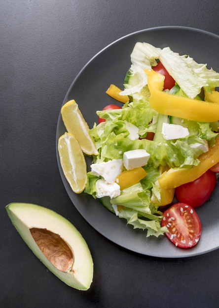 Top view delicious salad with fresh vegetables