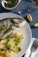 Free photo top view delicious seabream and potatoes