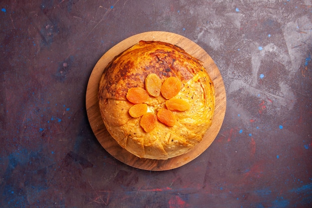 Top view delicious shakh plov eastern meal consists of cooked rice inside round dough on dark desk rice dough meal dinner food cuisine