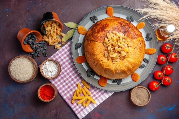 Top view delicious shakh plov eastern meal consists of cooked rice inside round dough on dark surface meal dough cooking food rice