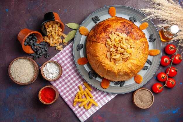 Top view delicious shakh plov eastern meal consists of cooked rice inside round dough on dark surface meal dough cooking food rice