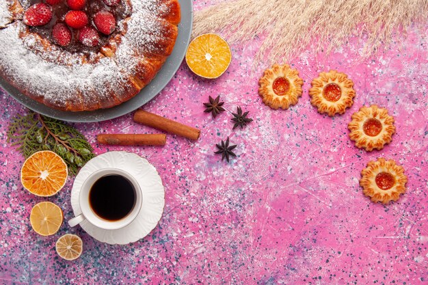 Top view delicious strawberry cake sugar powdered cake with cookies and cup of tea on pink background cake sweet sugar biscuit cookies pie