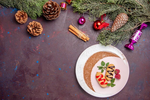 Top view delicious sweet biscuits with christmas tree on dark background cookie sweet biscuit sugar color cake