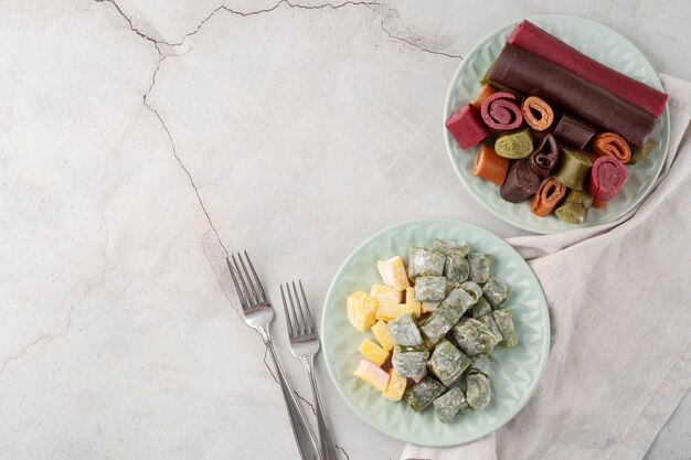 Top view delicious sweets on plates