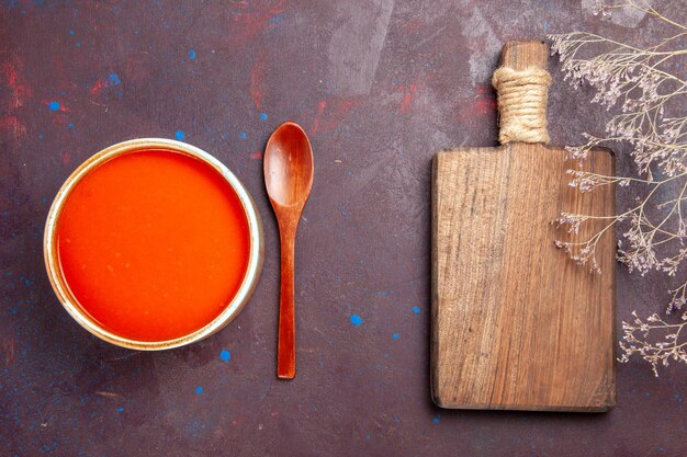 Top view delicious tomato soup cooked from fresh tomatoes on dark desk dish sauce meal tomato soup