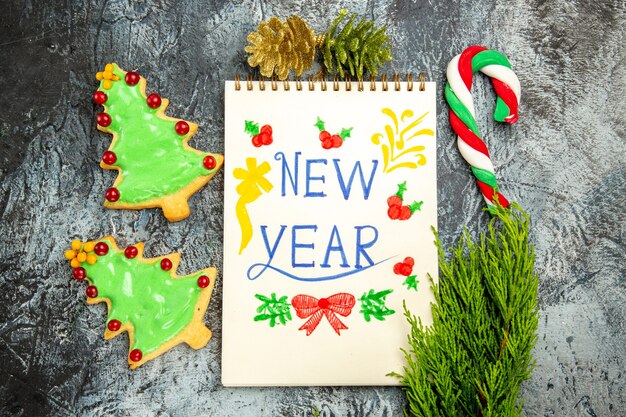 Top view delicious tree biscuits with new year note