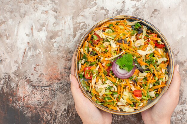 Top view of delicious vegan salad with various vegetables