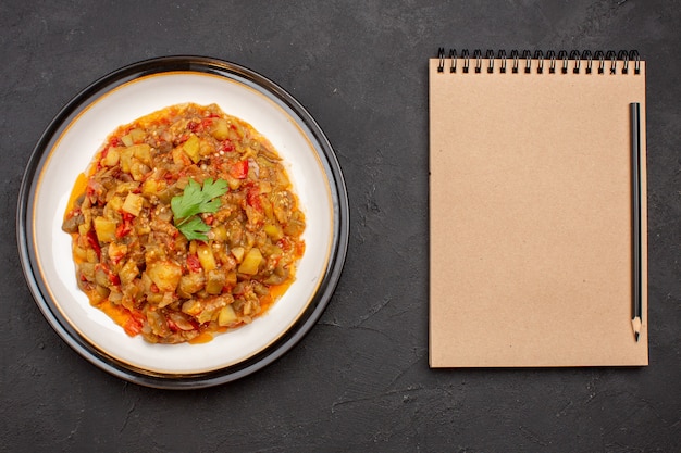 Top view delicious vegetable meal sliced cooked dish inside plate on a grey background dinner meal food sauce soup