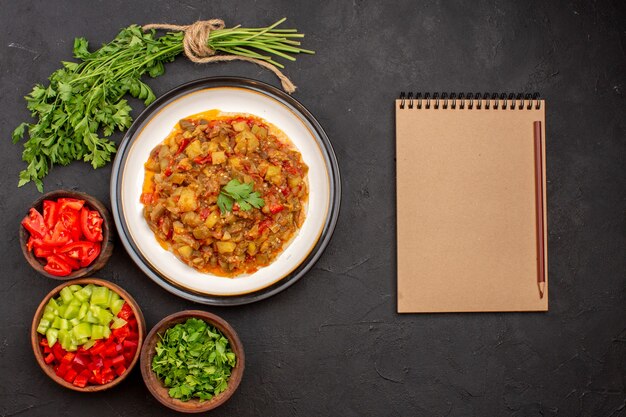 Top view delicious vegetable meal sliced cooked dish inside plate on a grey background meal dinner food sauce soup vegetable