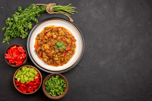 Top view delicious vegetable meal sliced cooked dish inside plate on grey background meal dinner food sauce soup vegetables