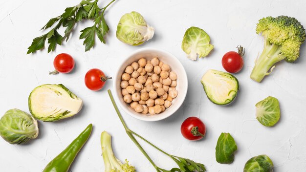 Top view delicious vegetables on white background