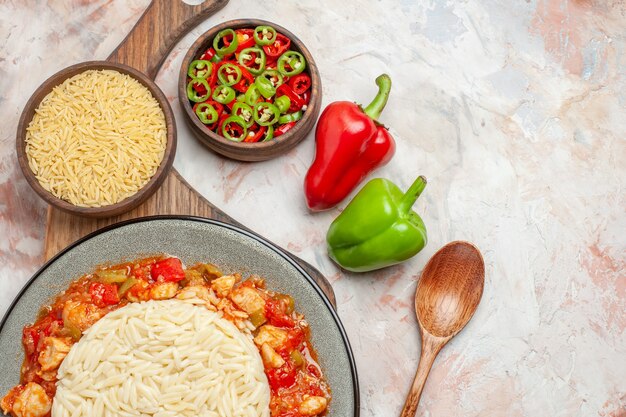 Top view of delicious white rice meal with chicken and vegetables