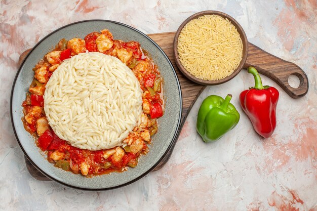 Top view of delicious white rice meal with chicken and vegetables