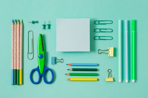 Top view desk arrangement with green items