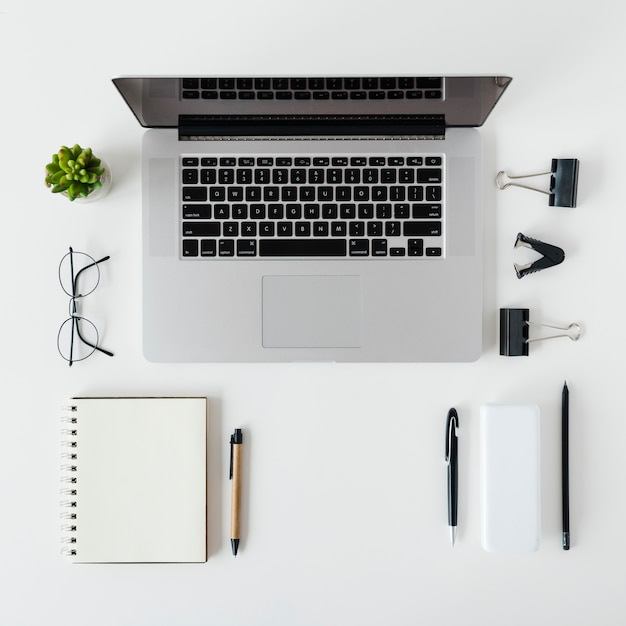 Top view desk arrangement with laptop