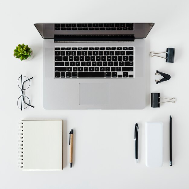 Top view desk arrangement with laptop