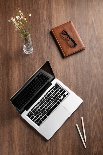 Top view desk arrangement with laptop