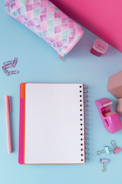 Top view desk arrangement with notebook