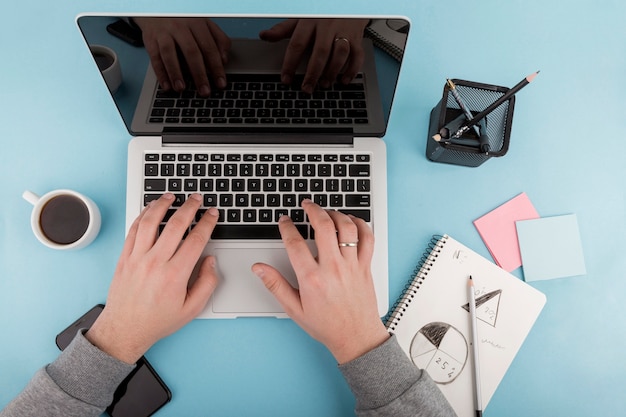 Top view of desk concept with laptop