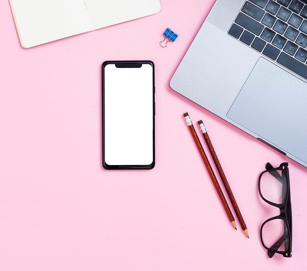 Top view desk concept with mock-up smartphone