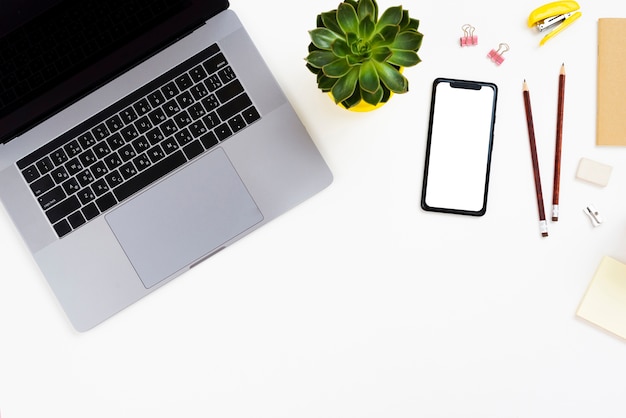 Top view desk concept with mock-up smartphone