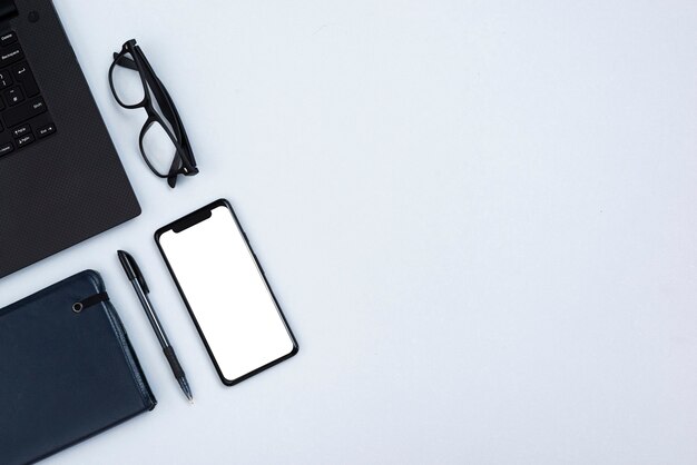 Top view desk concept with mock-up smartphone