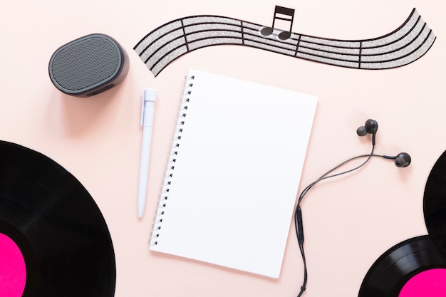 Top view desk concept with music theme