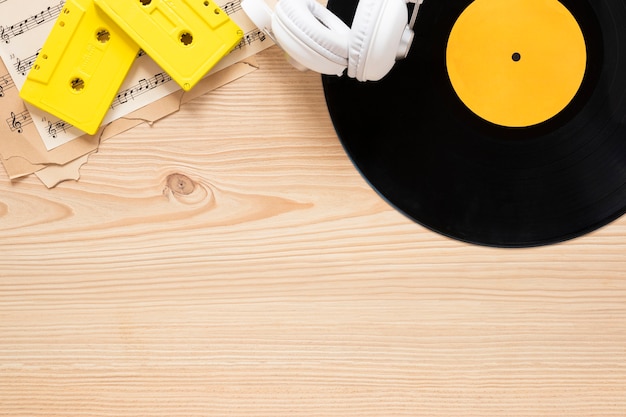 Top view desk concept with music theme