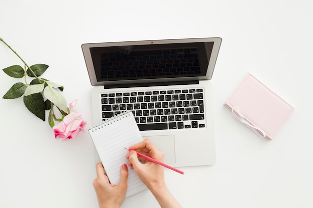 Top view desk concept with woman hands