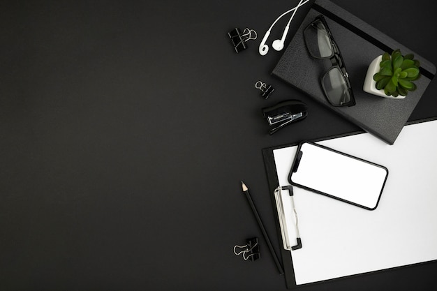 Top view of desk dark concept with copy space