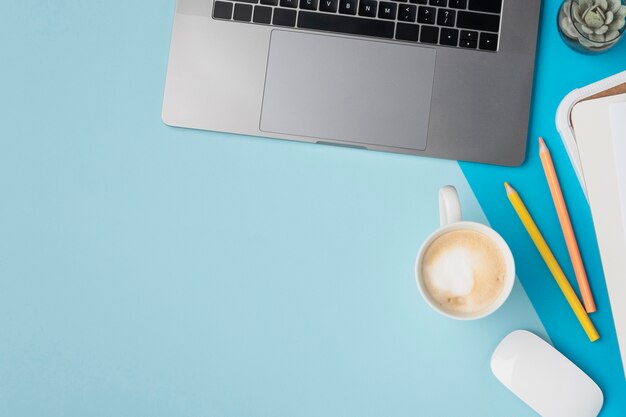 Top view desk with laptop and coffee mug