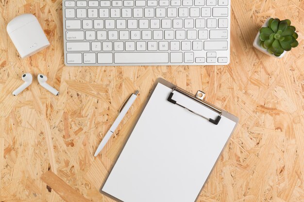 Top view of desk with notepad and keyboard