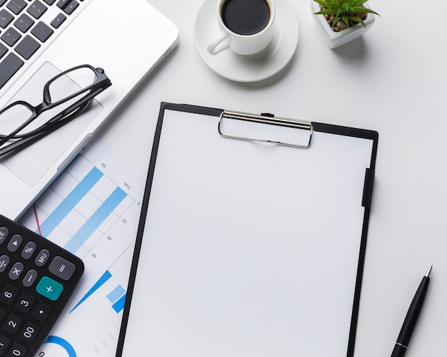 Top view of desktop with paper and calculator