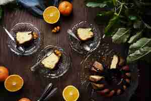 Free photo top view dessert and oranges arrangement