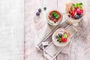 Free photo top view of desserts with coffee beans and strawberries