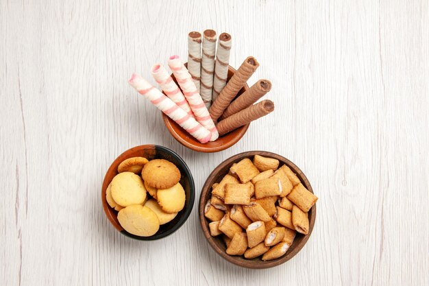 Top view different cookies on white desk sugar biscuit sweet cookie