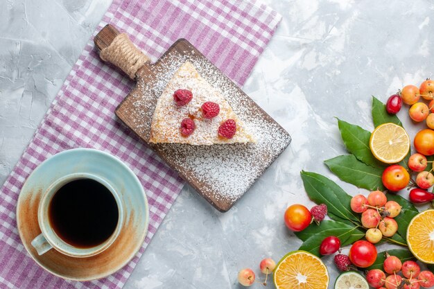 Top view different fresh fruits with pie slice and tea on the light-white desk fruit fresh mellow